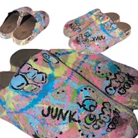 a pair of colorful clogs with graffiti on them